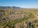 Aerial view of a golf course community with mountain backdrop at 7227 E Texas Ebony Dr, Gold Canyon, AZ 85118