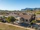 Aerial view of a house with a backyard patio and mountain views at 7227 E Texas Ebony Dr, Gold Canyon, AZ 85118