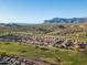 Aerial view of community near golf course and mountains at 7227 E Texas Ebony Dr, Gold Canyon, AZ 85118