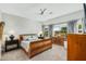 Bright bedroom with wood furniture and golf course view at 7227 E Texas Ebony Dr, Gold Canyon, AZ 85118