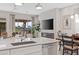 Modern kitchen with marble countertops and a fireplace at 7227 E Texas Ebony Dr, Gold Canyon, AZ 85118