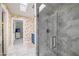 Elegant bathroom features a walk-in shower, marble tile, and skylight at 7528 N 10Th St, Phoenix, AZ 85020