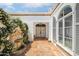 Elegant courtyard entry with a fountain and ornate doors at 7528 N 10Th St, Phoenix, AZ 85020