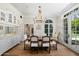 Formal dining room with a chandelier and French doors leading to the patio at 7528 N 10Th St, Phoenix, AZ 85020