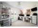 Home office with built-in shelving, two workstations, and a view at 7528 N 10Th St, Phoenix, AZ 85020