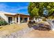 Large backyard with patio, lemon tree, and rock garden at 7911 E Desert Trl, Mesa, AZ 85208