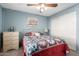 Bright bedroom with a queen bed and ample closet space at 7911 E Desert Trl, Mesa, AZ 85208