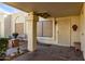 Covered entryway with tile flooring and seating area at 7911 E Desert Trl, Mesa, AZ 85208