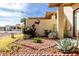 Neatly landscaped front yard with desert plants at 7911 E Desert Trl, Mesa, AZ 85208