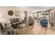 Living room with striped sofas, recliner, and coffee table at 7911 E Desert Trl, Mesa, AZ 85208