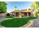 Large backyard with grassy lawn and covered patio area at 921 E Becker Ln, Phoenix, AZ 85020