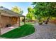 Landscaped backyard with pergola and grass at 921 E Becker Ln, Phoenix, AZ 85020