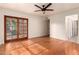 Bright bedroom with hardwood floors and sliding glass doors to patio at 921 E Becker Ln, Phoenix, AZ 85020