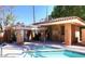 Community pool and spa area with covered seating and gated access at 921 E Becker Ln, Phoenix, AZ 85020