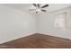 Bright bedroom with ceiling fan and wood-look flooring at 955 N Jay St, Chandler, AZ 85225