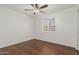 Well-lit bedroom featuring wood-look floors and window blinds at 955 N Jay St, Chandler, AZ 85225