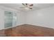 Bedroom with sliding door to patio and ceiling fan at 955 N Jay St, Chandler, AZ 85225