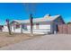 Side view of a white brick house with a gate at 955 N Jay St, Chandler, AZ 85225