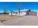 Front view of a white brick house with a gate at 955 N Jay St, Chandler, AZ 85225