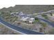 Aerial view of a contemporary home with a private driveway and mountain views at 9823 E Dead Sure Pl, Gold Canyon, AZ 85118