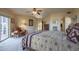 Large bedroom with a king-size bed and access to a patio at 9823 E Dead Sure Pl, Gold Canyon, AZ 85118