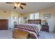 Bright bedroom with a queen-size bed and ensuite bathroom access at 9823 E Dead Sure Pl, Gold Canyon, AZ 85118