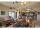 Bright dining area with wood table and chairs, adjacent to kitchen at 9823 E Dead Sure Pl, Gold Canyon, AZ 85118