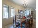 Spacious dining room with wood table, chandelier, and views at 9823 E Dead Sure Pl, Gold Canyon, AZ 85118