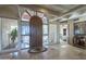 Bright and spacious entryway with a wooden door and tiled floors at 9823 E Dead Sure Pl, Gold Canyon, AZ 85118