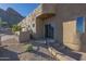 Home exterior with desert landscaping and gated entry at 9823 E Dead Sure Pl, Gold Canyon, AZ 85118