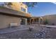 Outdoor patio area with desert landscaping and a bench at 9823 E Dead Sure Pl, Gold Canyon, AZ 85118