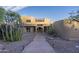 Modern Southwestern home with a unique architectural design and desert landscaping at 9823 E Dead Sure Pl, Gold Canyon, AZ 85118