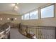 Upper level hallway with window views and sitting area at 9823 E Dead Sure Pl, Gold Canyon, AZ 85118