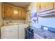 Laundry room with washer, dryer, and cabinets at 9823 E Dead Sure Pl, Gold Canyon, AZ 85118