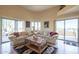 Comfortable living room with sectional sofa and large windows at 9823 E Dead Sure Pl, Gold Canyon, AZ 85118