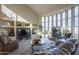 Living room with a fireplace and large windows at 9823 E Dead Sure Pl, Gold Canyon, AZ 85118