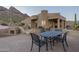 Spacious patio features dining area and built-in grill, mountain views at 9823 E Dead Sure Pl, Gold Canyon, AZ 85118