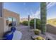 Desert landscape with patio and blue pots at 9823 E Dead Sure Pl, Gold Canyon, AZ 85118