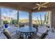 Covered patio with mountain views and seating for four at 9823 E Dead Sure Pl, Gold Canyon, AZ 85118