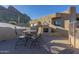 Relaxing patio with seating area, fire pit, and mountain views at 9823 E Dead Sure Pl, Gold Canyon, AZ 85118