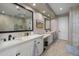 Elegant bathroom with dual vanities and a large mirror at 9909 E Lookout Mountain Dr, Scottsdale, AZ 85262