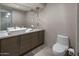 Modern bathroom with a floating vanity and a large mirror at 9909 E Lookout Mountain Dr, Scottsdale, AZ 85262