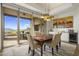 Bright dining room with mountain views and access to a patio at 9909 E Lookout Mountain Dr, Scottsdale, AZ 85262