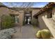 Inviting entryway with courtyard landscaping and a charming pathway at 9909 E Lookout Mountain Dr, Scottsdale, AZ 85262