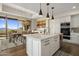 Bright kitchen with island, stainless steel appliances, and mountain views at 9909 E Lookout Mountain Dr, Scottsdale, AZ 85262