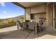 Outdoor dining area with built-in grill and mountain views at 9909 E Lookout Mountain Dr, Scottsdale, AZ 85262