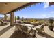 Covered patio with firepit and seating area, offering stunning mountain views at 9909 E Lookout Mountain Dr, Scottsdale, AZ 85262