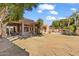 Spacious backyard with grassy area and large home at 11691 E Turquoise Ave, Scottsdale, AZ 85259
