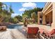Inviting backyard with pool, lounge chairs, and lush landscaping at 11691 E Turquoise Ave, Scottsdale, AZ 85259