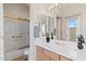 Clean bathroom with a single sink and shower/tub combo at 11691 E Turquoise Ave, Scottsdale, AZ 85259